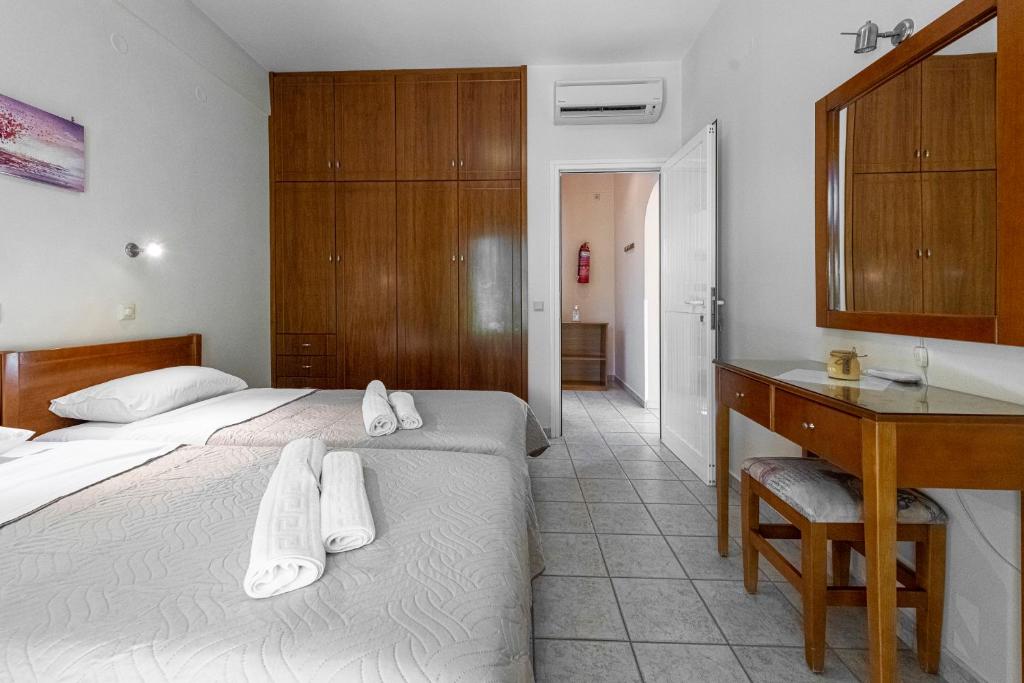 Postel nebo postele na pokoji v ubytování Anesis Residence