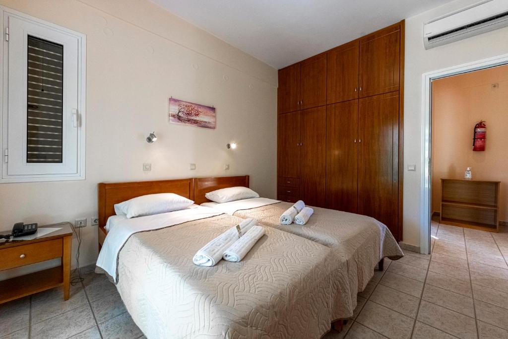 Postel nebo postele na pokoji v ubytování Anesis Residence