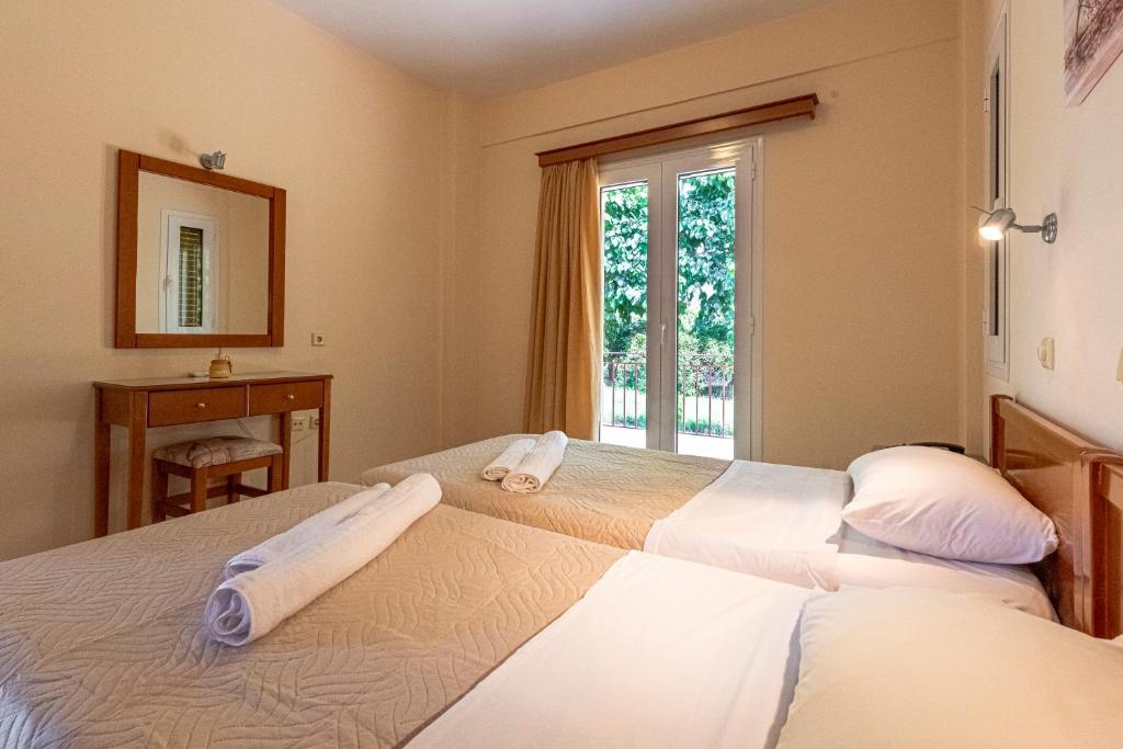 Postel nebo postele na pokoji v ubytování Anesis Residence