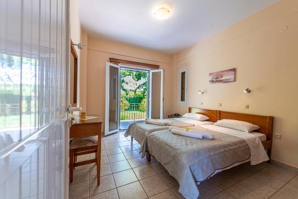 Postel nebo postele na pokoji v ubytování Anesis Residence