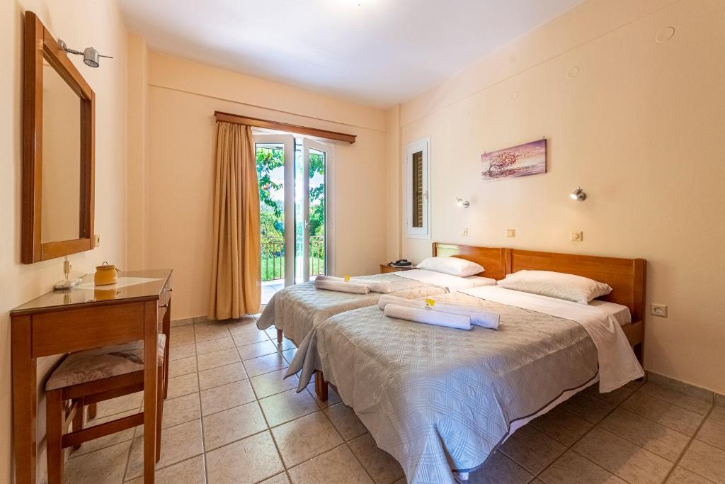 Postel nebo postele na pokoji v ubytování Anesis Residence