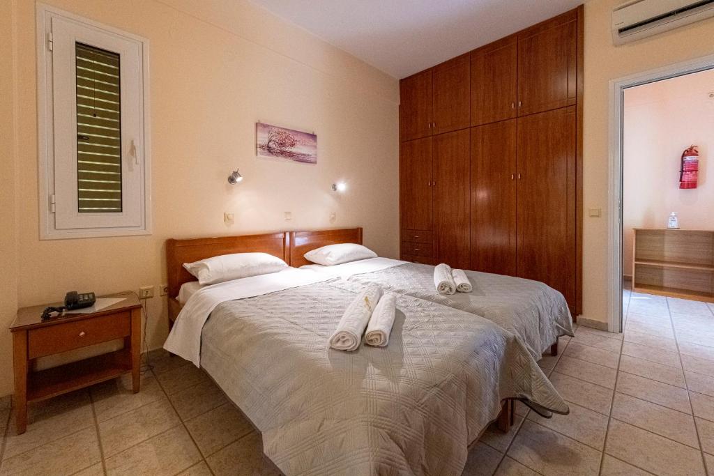Postel nebo postele na pokoji v ubytování Anesis Residence