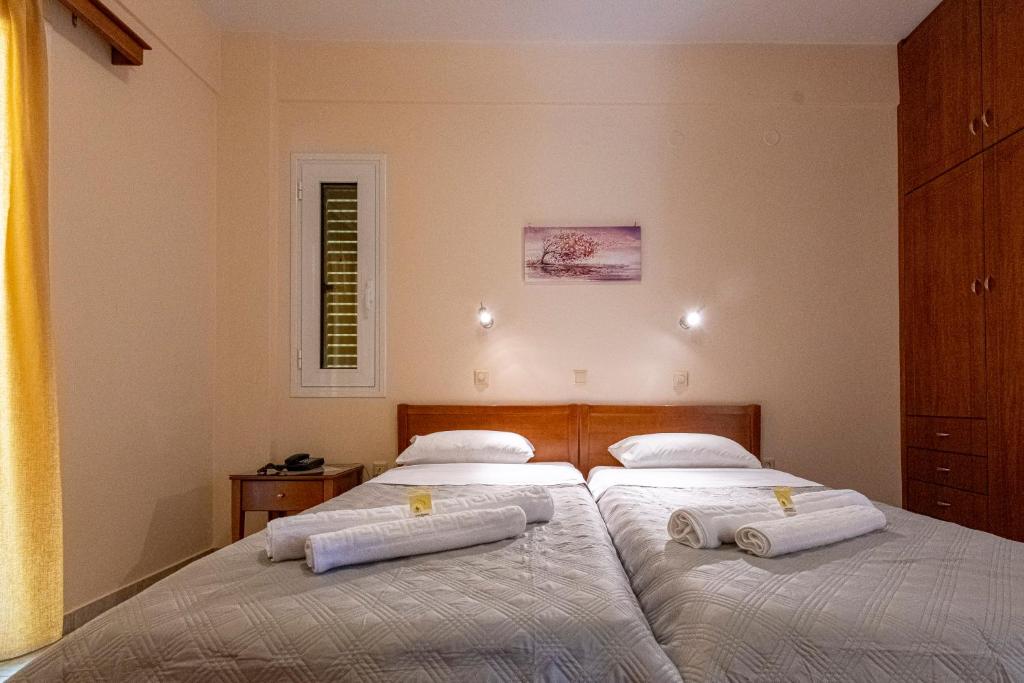 Postel nebo postele na pokoji v ubytování Anesis Residence