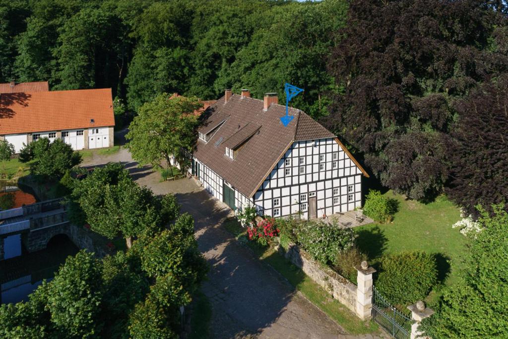 an aerial view of a house with a roof at Ferienhaus am Wasserschloss Haus Marck in Tecklenburg