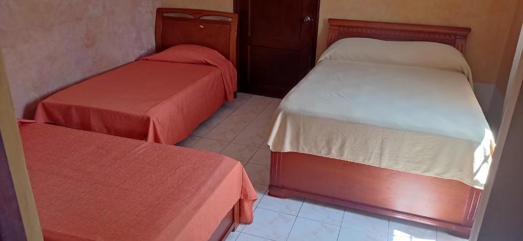 Postel nebo postele na pokoji v ubytování Canal Inn Panama