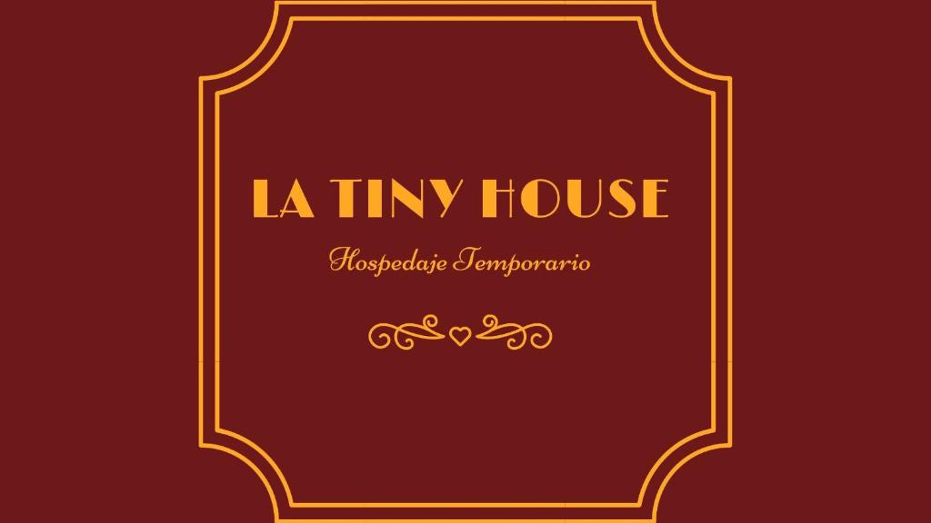a gold frame with the text la thy house at La Tiny House in Ushuaia