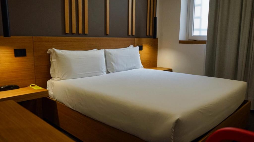 Postel nebo postele na pokoji v ubytování Central Lodge Hotel