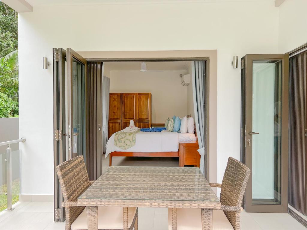 Postel nebo postele na pokoji v ubytování Palm Holiday Apartments
