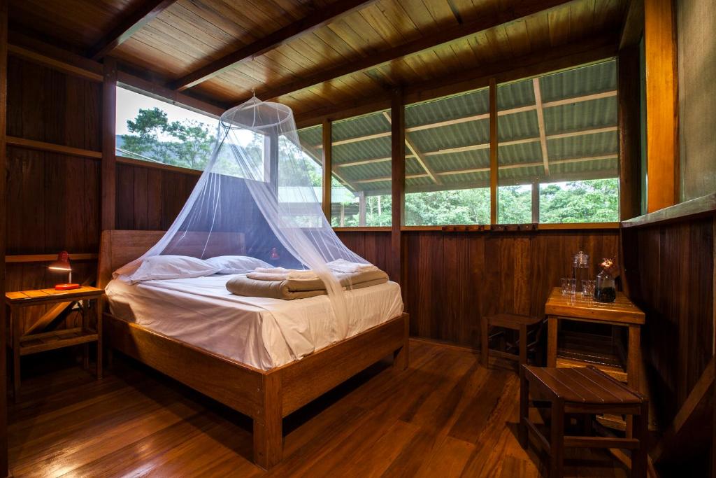 Postel nebo postele na pokoji v ubytování Kuporo lodge
