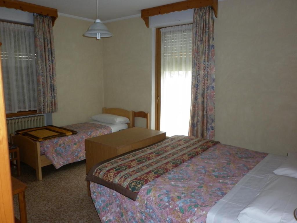 Letto o letti in una camera di Hotel Zebrù