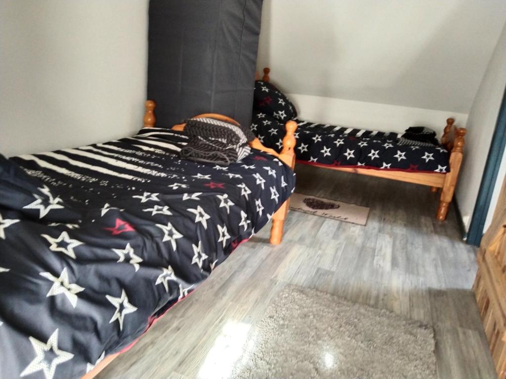 Postel nebo postele na pokoji v ubytování Craftycotta