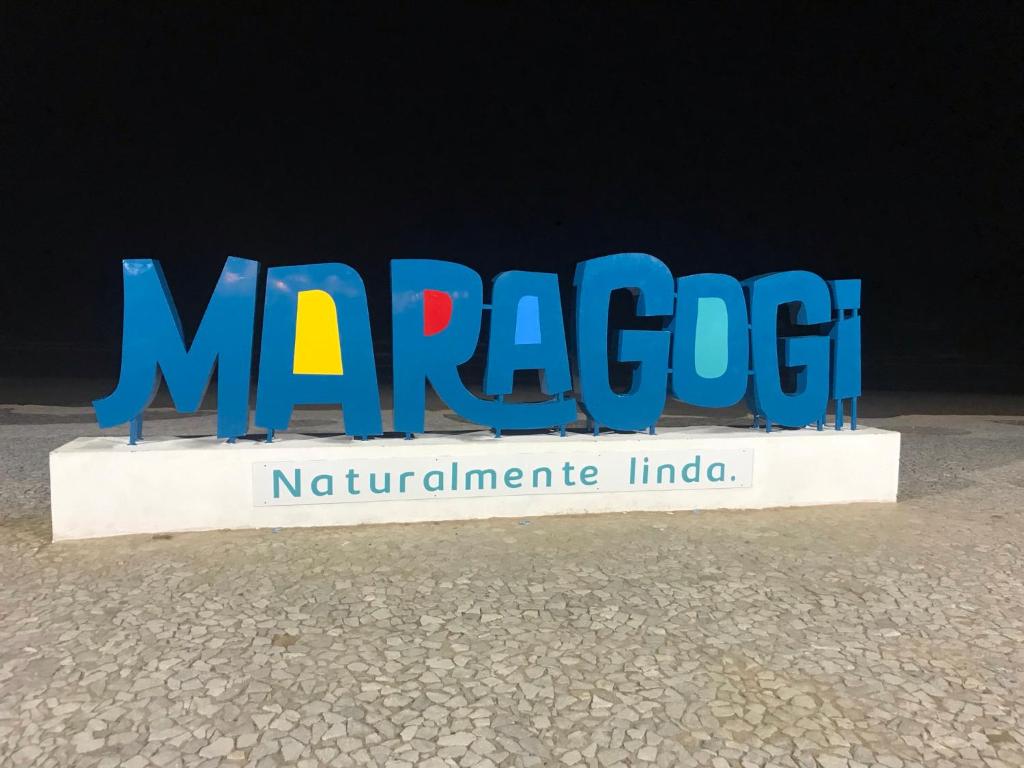 a sign for the marragut nirvanainylinylinylinyl at Maragobeach Suits in Maragogi