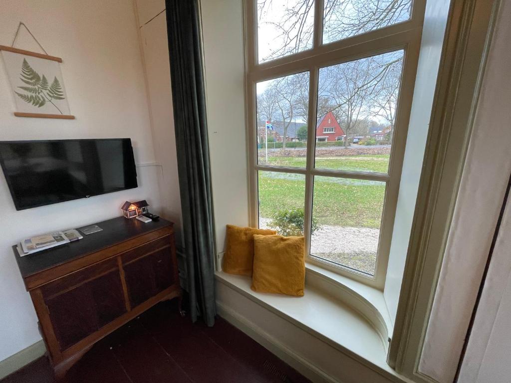 Fotografie z fotogalerie ubytování Suite in prachtige Groningse boerderij uit 1856 v destinaci Schildwolde