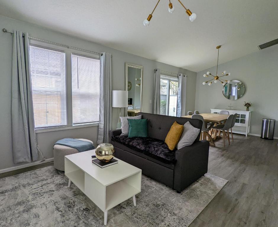 a living room with a couch and a table at Contemporary 2-Bedroom Close to Downtown, Dining in Eugene