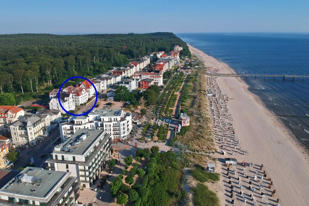 an aerial view of a beach with a blue circle at Ferienwohnung Kon-Tiki, Villa Regina Maris Bansin in Heringsdorf