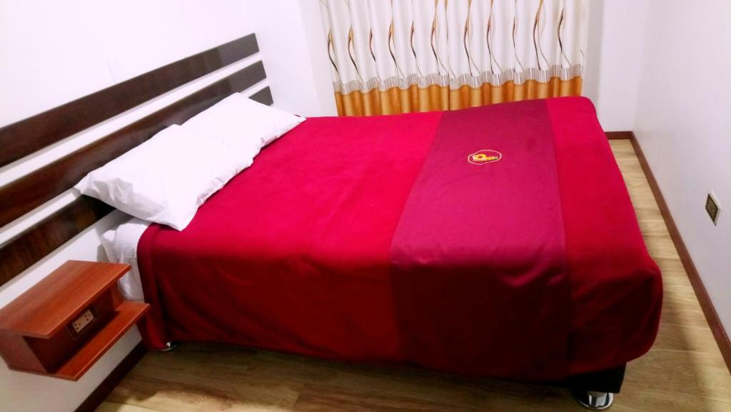 Postel nebo postele na pokoji v ubytování Pukantu Hostal