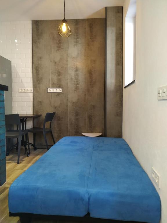 Posteľ alebo postele v izbe v ubytovaní Altozano Room III, Estudió centro de Málaga Gayfriendly, Wi-Fi gratis