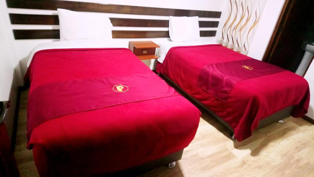 Postel nebo postele na pokoji v ubytování Pukantu Hostal