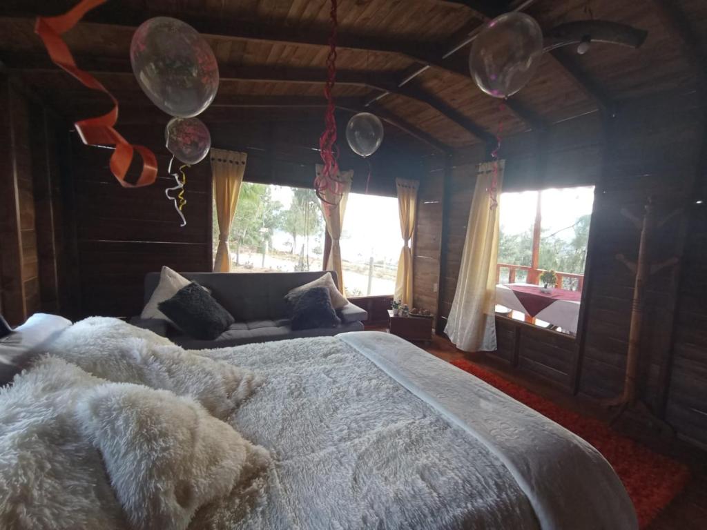 Postel nebo postele na pokoji v ubytování Cabaña Sueños Dorados