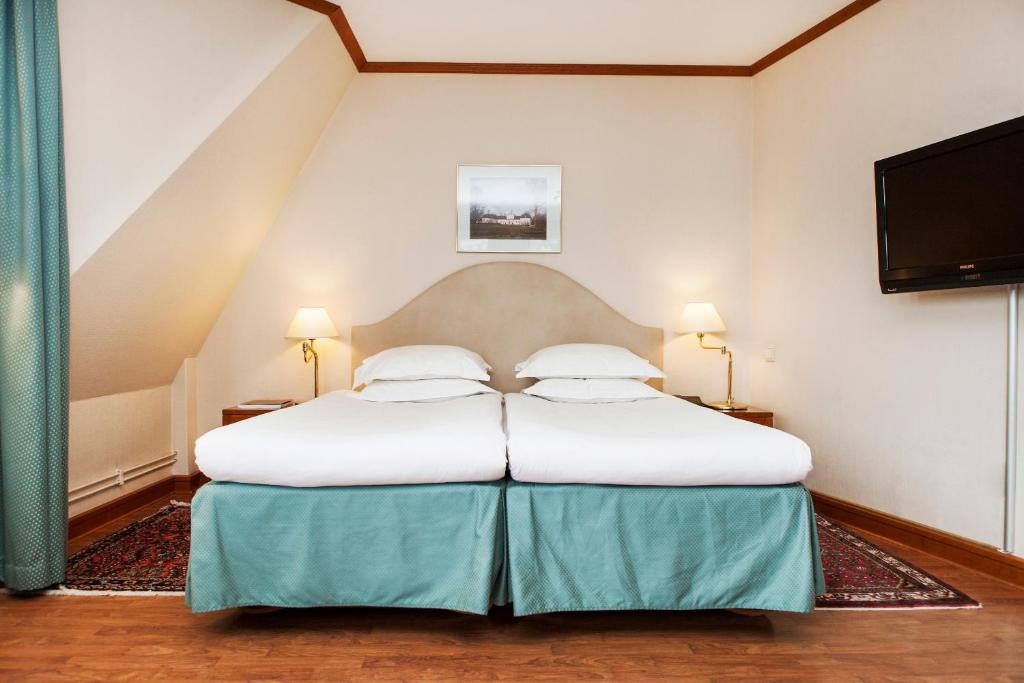Postel nebo postele na pokoji v ubytování Hotel Bishops Arms Malmö