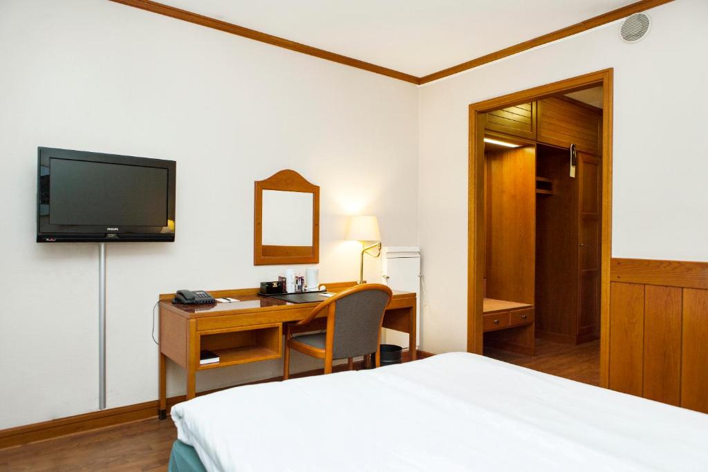 Postel nebo postele na pokoji v ubytování Hotel Bishops Arms Malmö