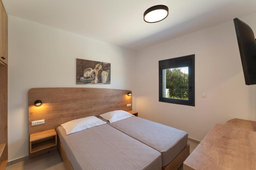 Postel nebo postele na pokoji v ubytování Domus Oliva Villas