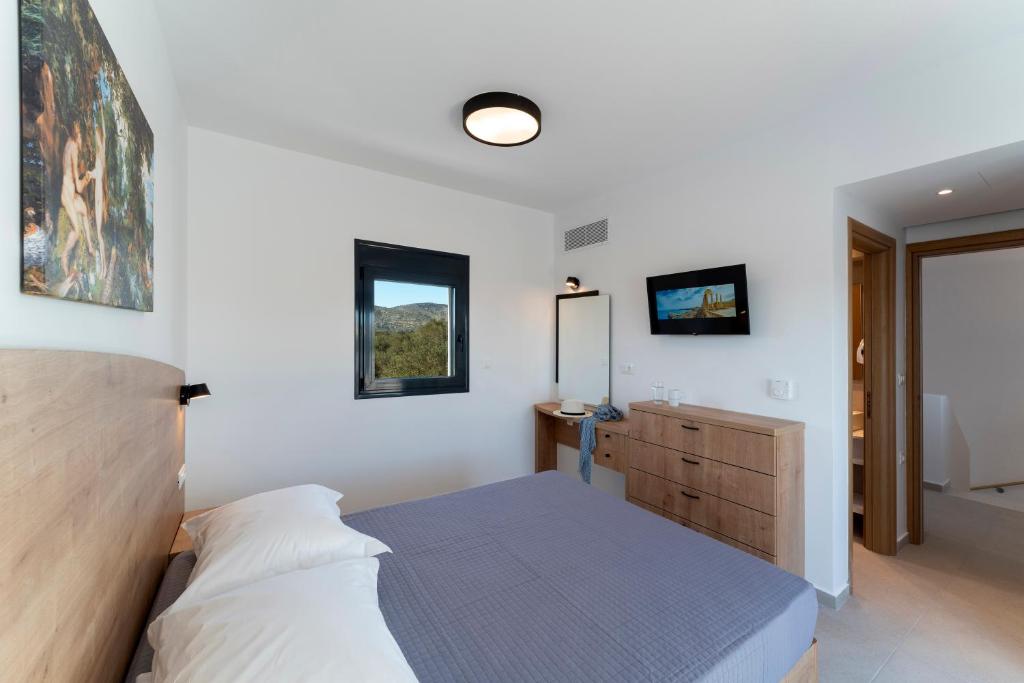 Postel nebo postele na pokoji v ubytování Domus Oliva Villas