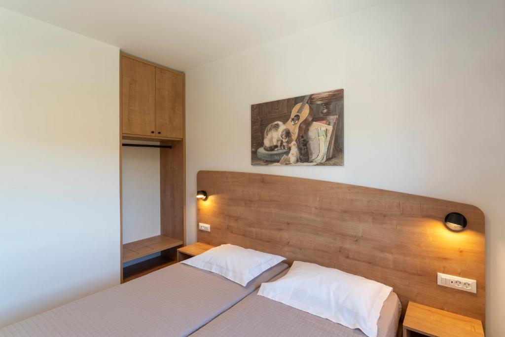 Postel nebo postele na pokoji v ubytování Domus Oliva Villas