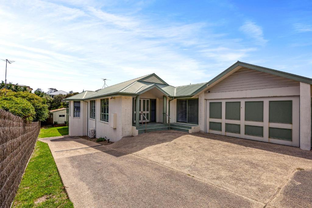 a large house with a garage at Sand and Foam in Sorrento