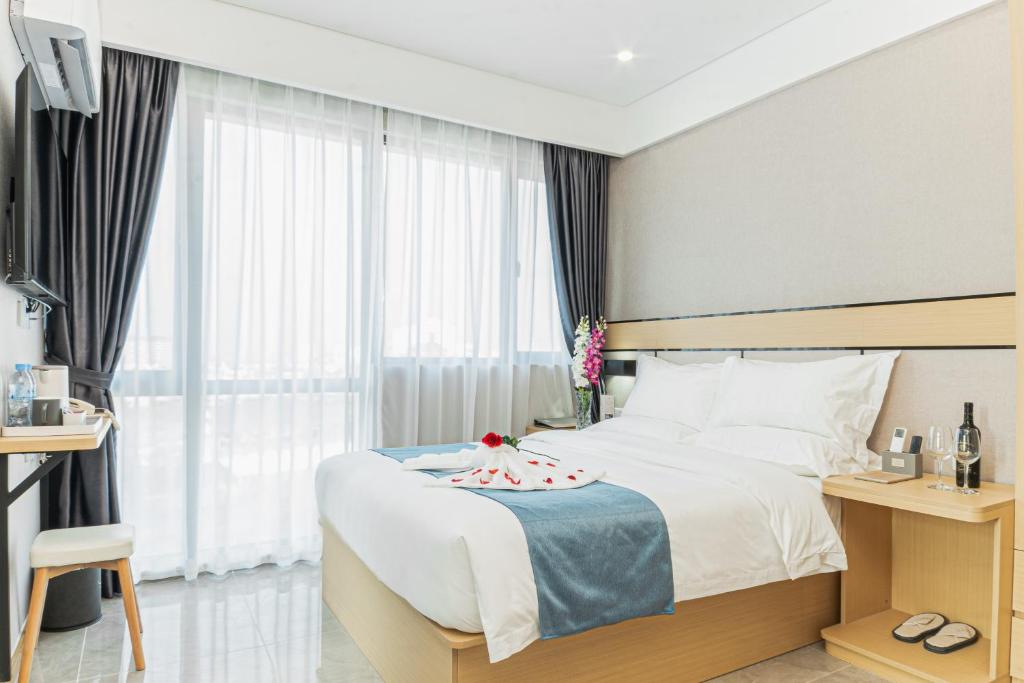 Postel nebo postele na pokoji v ubytování ARK HOTEL