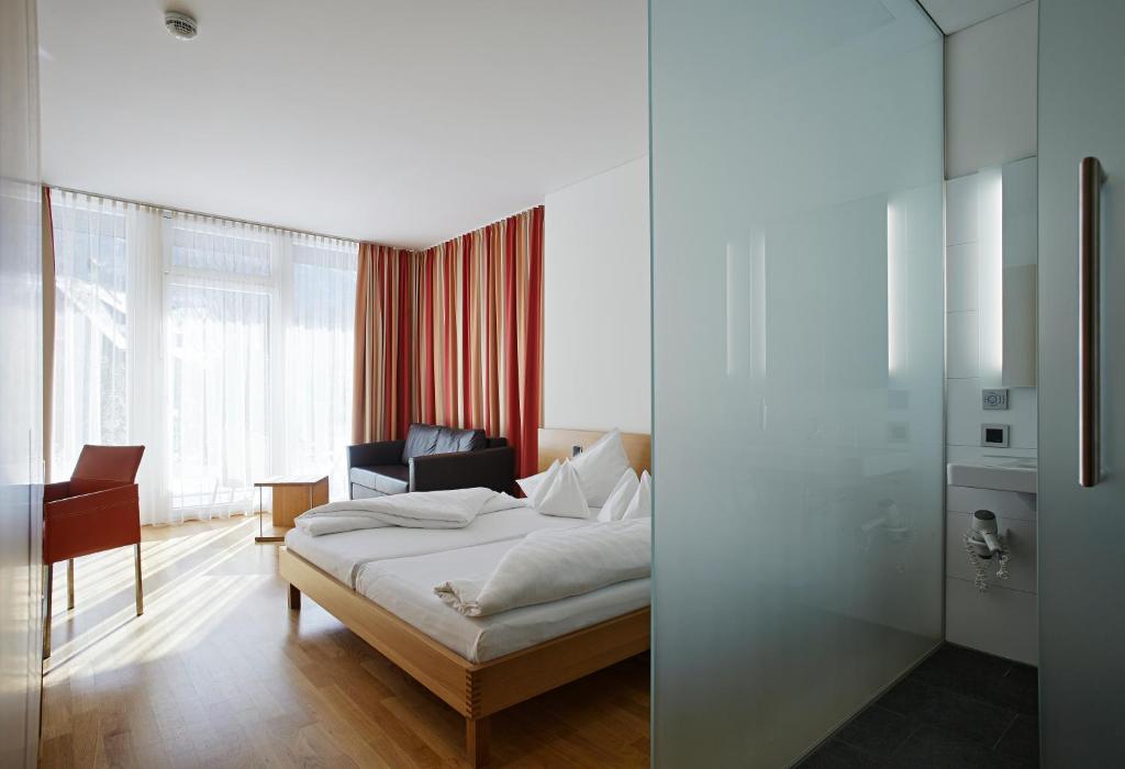 Postel nebo postele na pokoji v ubytování Hotel Krone