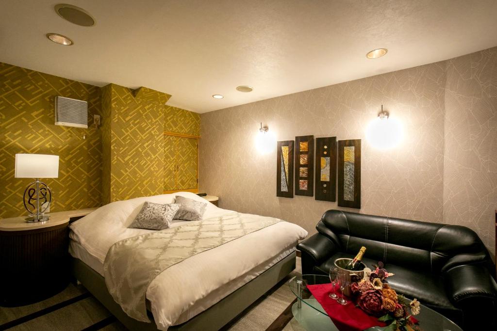 Postel nebo postele na pokoji v ubytování Hotel EXE アネックス 大人専用
