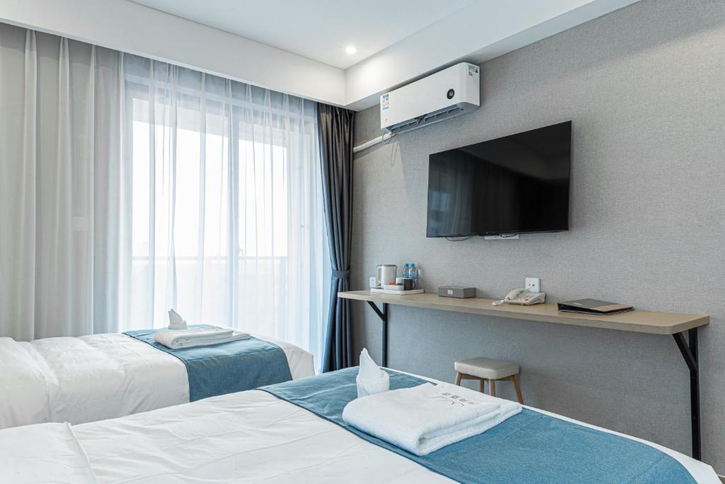 Postel nebo postele na pokoji v ubytování ARK HOTEL
