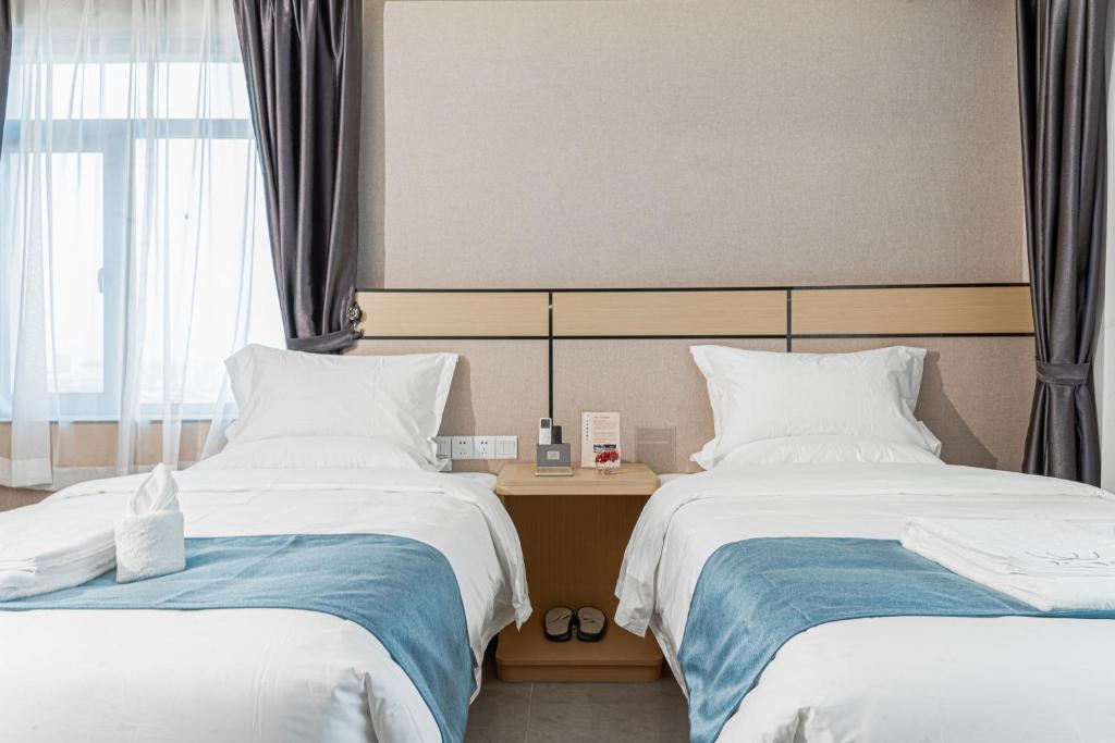 Postel nebo postele na pokoji v ubytování ARK HOTEL