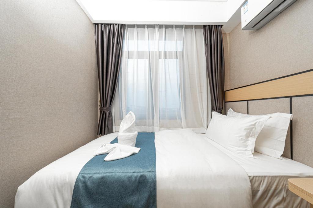Postel nebo postele na pokoji v ubytování ARK HOTEL