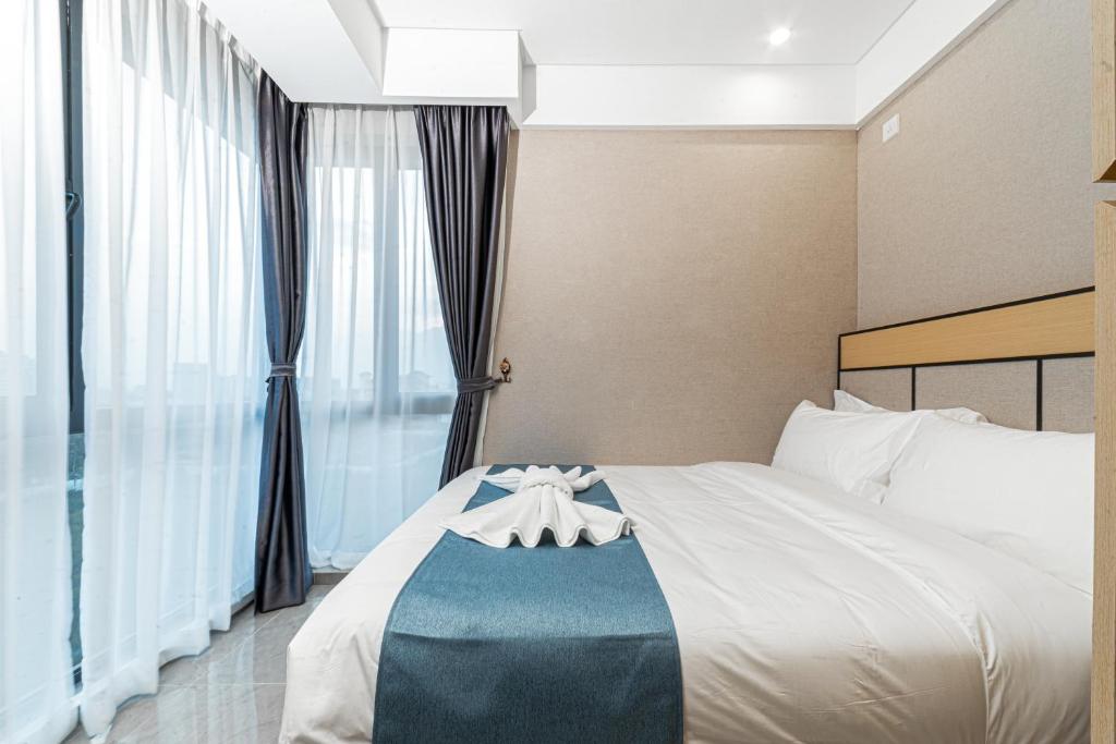 Postel nebo postele na pokoji v ubytování ARK HOTEL