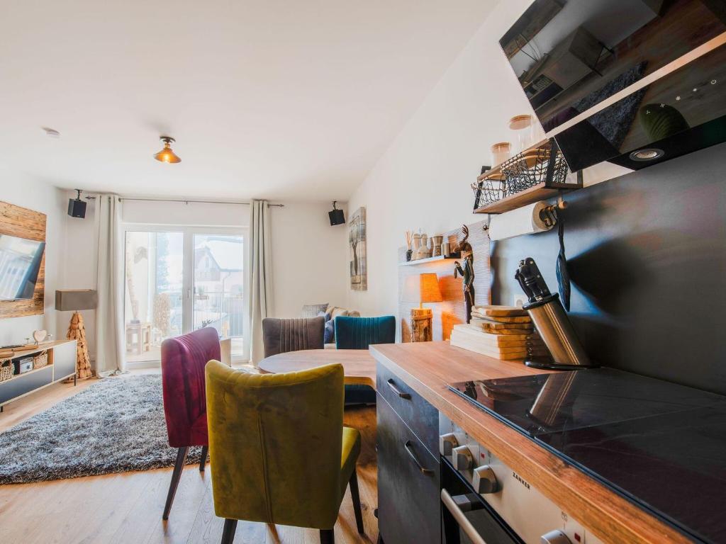 Televízia a/alebo spoločenská miestnosť v ubytovaní Hochwertige Ferienwohnung mit tollem Ausblick