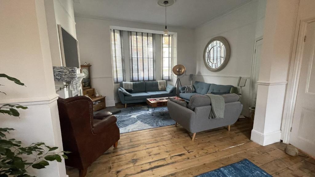 a living room with two chairs and a couch at The Broadstairs Townhouse in Broadstairs