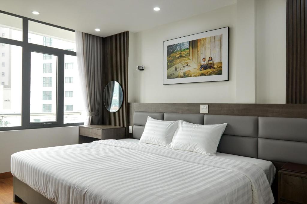 Ліжко або ліжка в номері Van Nam Hotel