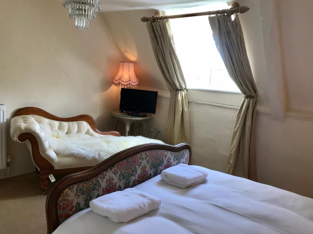 Postel nebo postele na pokoji v ubytování Buscot Manor