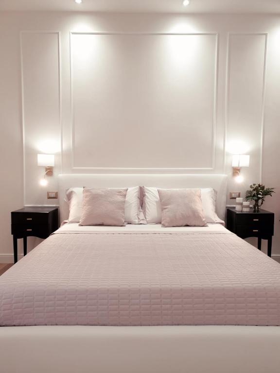 A bed or beds in a room at Viale Italia Boutique Rooms