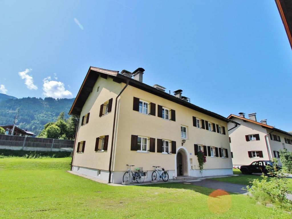 a building with two bikes parked in front of it at Charming Apartment in Kitzbuhel with Balcony in Kitzbühel