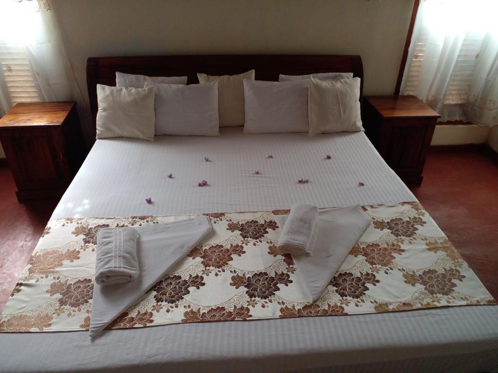 Postel nebo postele na pokoji v ubytování 4ty two Homestay Galle