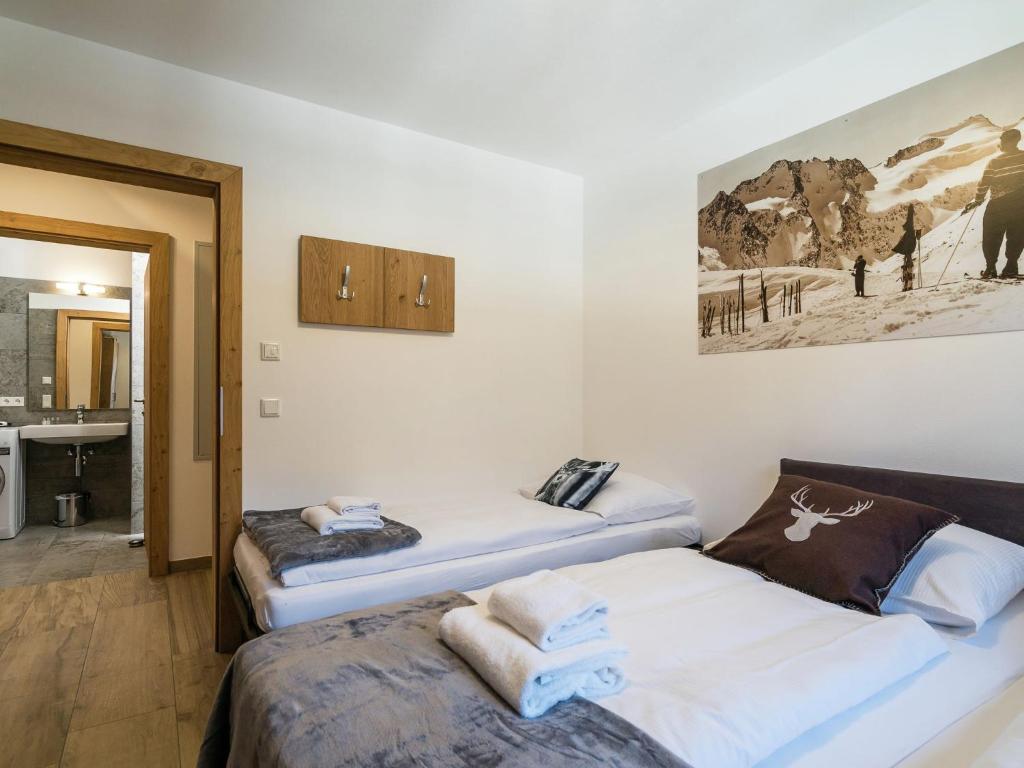 Posteľ alebo postele v izbe v ubytovaní Apartment in ski area KitzSki Hollersbach