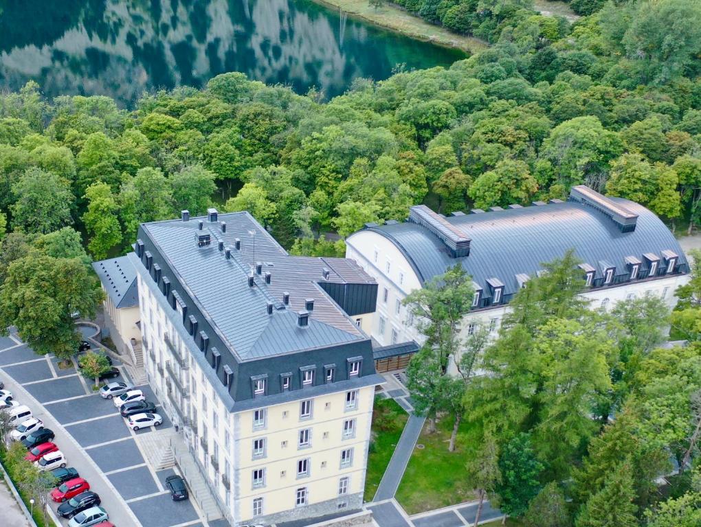 an aerial view of a building in the woods at Gran Hotel – Balneario de Panticosa in Panticosa