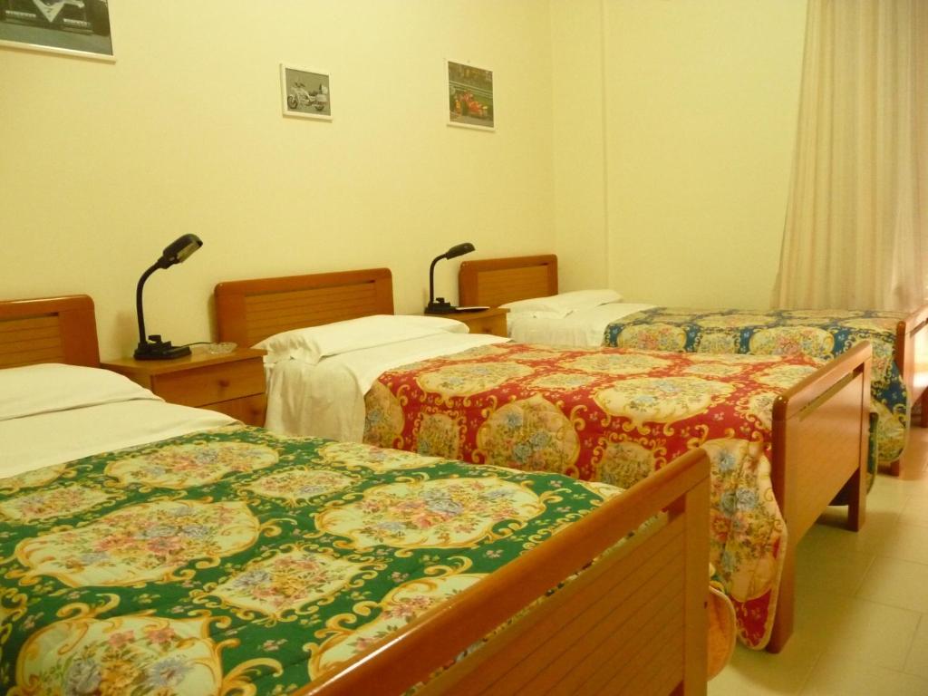 Postel nebo postele na pokoji v ubytování Agathae Hotel & Residence