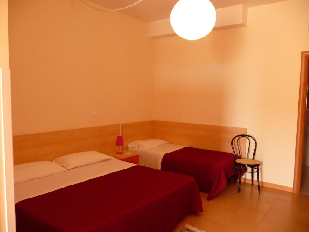 Postel nebo postele na pokoji v ubytování Agathae Hotel & Residence
