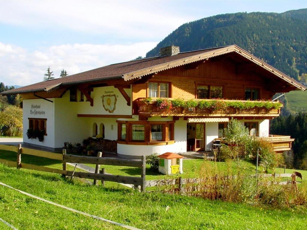a house with a fence in front of it at Splendid Apartment in Schladming with Sauna in Schladming