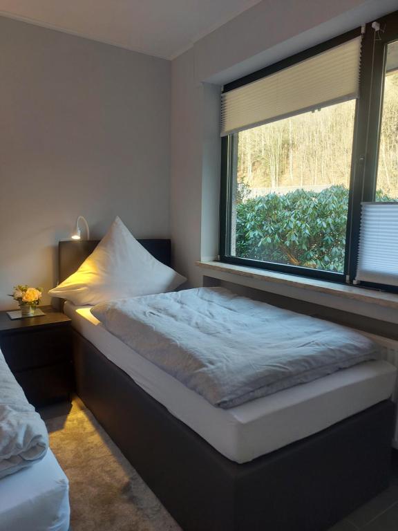 Postel nebo postele na pokoji v ubytování Ferienwohnung Haus Ilse