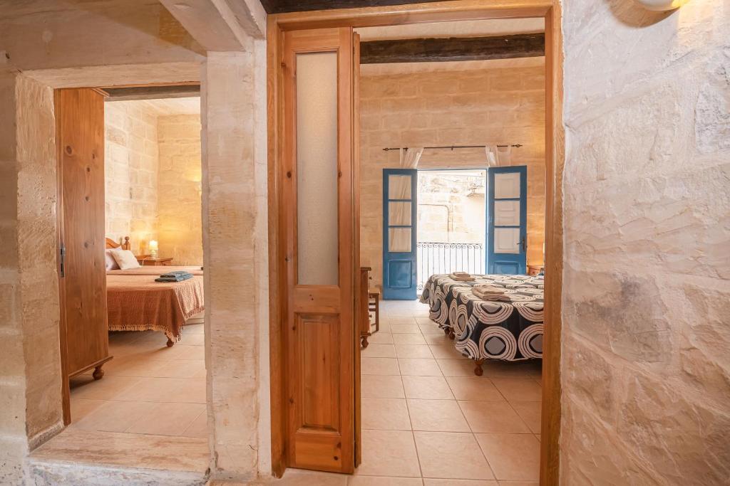 Postel nebo postele na pokoji v ubytování Casa Melita